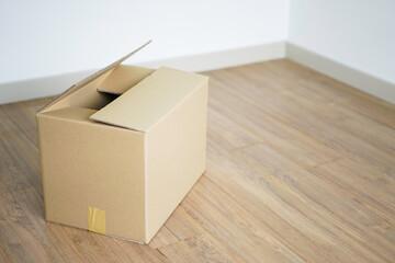Copyspace: Box in empty room as moving to new house concept