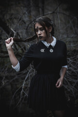 Witch in the form of a student in the forest