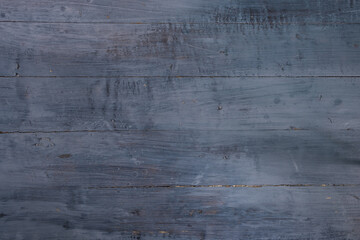Old wooden floor covered with light gray lacquer. Textured background.