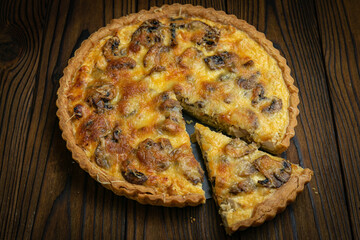 Mushroom pie on a brown wooden table
