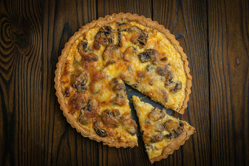Mushroom pie on a brown wooden table
