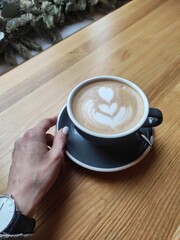 cup of coffee in hand