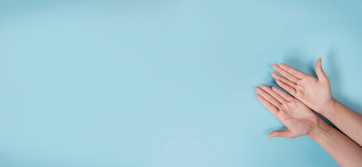 woman hand isolated on pastel blue background