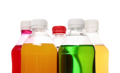 Bottles of soft drinks on white background, closeup