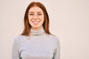 Young irish teenager girl smiling happy walking at the city.