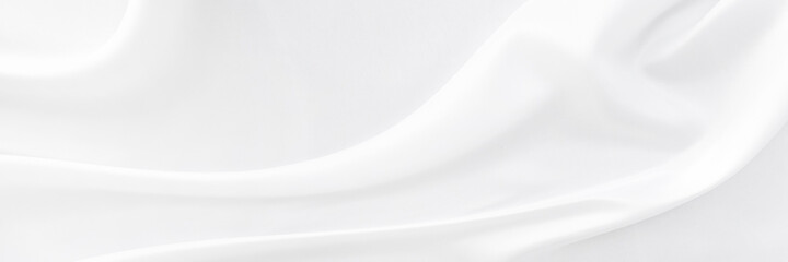 White gray satin texture that is white silver fabric silk panorama background with beautiful soft blur pattern natural.