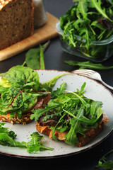 Sandwiches with salmon, avocado and salad