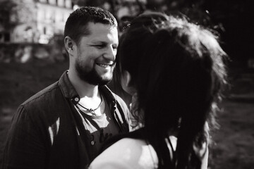 Evening walk of a beautiful young couple around the city. A loving couple travels.