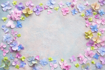 Obraz na płótnie Canvas Decorative background with colored hydrangea flowers, space for text