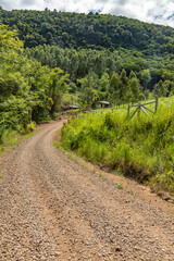 Obraz premium Farm meadow and valley with forest around