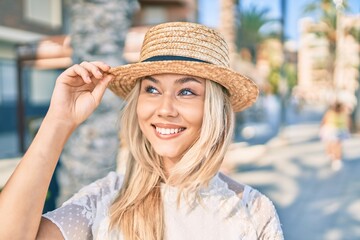 Young caucasian tourist girl smiling happy walking at street of city.