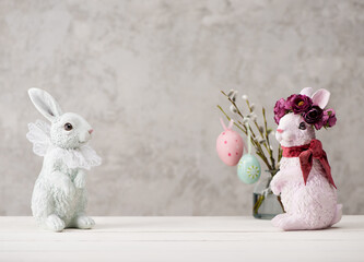 Happy Easter. Festive background with Easter eggs, willow branches and Easter bunny. copy space