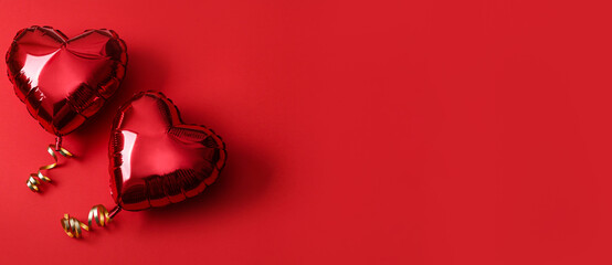Heart shaped balloons on red background, flat lay with space for text. Saint Valentine's day...