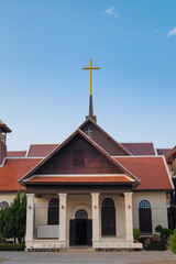 Old large Christian cross on the top of located church