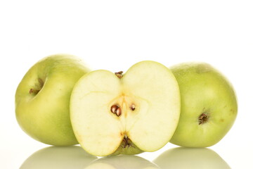 One half green apple of Renet Simirenko and two apples in the background, isolated on white.