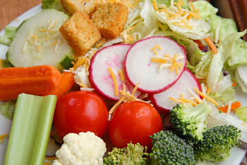 plain green salad side dish with variety of vegetables close up