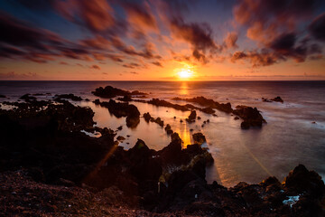 sunset on the ocean.
panorama of the coast in azores islands during sunset. portugal - 413563136