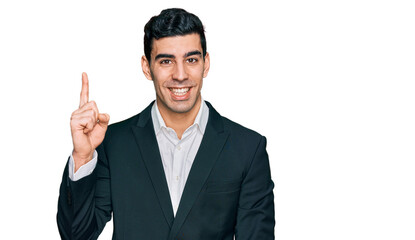 Handsome hispanic man wearing business clothes showing and pointing up with finger number one while smiling confident and happy.