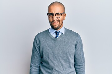 Hispanic adult man wearing glasses and business style winking looking at the camera with sexy...
