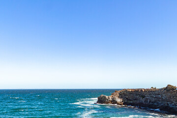 Cliff at blue sea at Hermanus south Africa