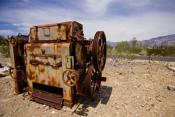 An old rusty fuel pump in the desert.