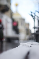 Naklejka na ściany i meble bench in the snow. cold snow in the city.