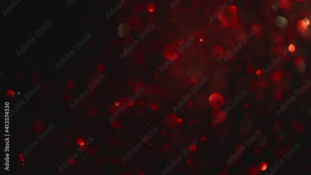 Poster Red bokeh in black background Abstract.