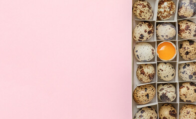 Decorative composition - quail eggs in a box on a delicate pink background. The concept of the Easter celebration, the diet of proper nutrition. Top view, flatly.