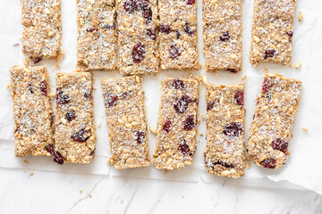 Vegan Energy Oat Bars With Coconut, Rice Puffs and Dried Cranberries Fruits, Flat Lay