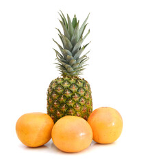 Grapefruits and pineapple on white background