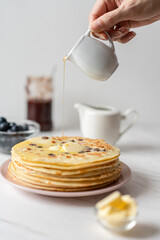 French Pancakes With Raisins served with Butter and Maple Syrup, Morning Breakfast