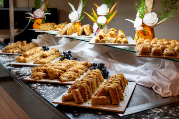 Open buffet full of delicious fruits with orange, grape, watermelon