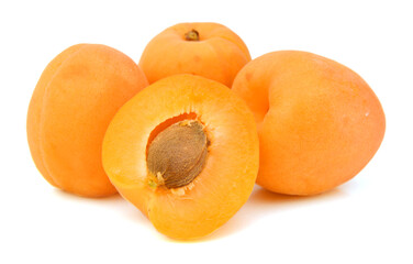 fresh yellow plums and a cut one on a white background