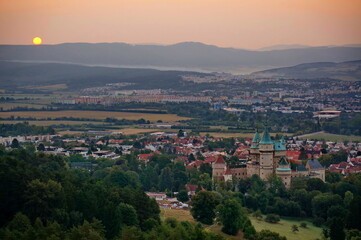 Fototapeta na wymiar Beautiful aerial view on Bojnice castle and town of Bojnice in a soft light at sunrise