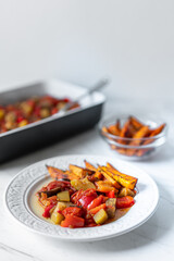 Vegetable Casserole With Chopped Tomatoes, Red Peppers, Zucchini, Eggplant served with Baked Sweet Potatoes