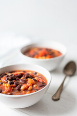 Vegetable Chili Bean Stew With Red Kidney Beans, Tomatoes, Sweetcorn, Red and Yellow Peppers On Flat Lay