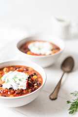 Vegetable Chili Bean Stew With Red Kidney Beans, Tomatoes, Sweetcorn, Red and Yellow Peppers On Flat Lay