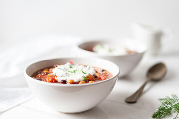 Vegetable Chili Bean Stew With Red Kidney Beans, Tomatoes, Sweetcorn, Red and Yellow Peppers On Flat Lay