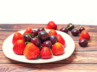 macro photo of strawberries and cherries