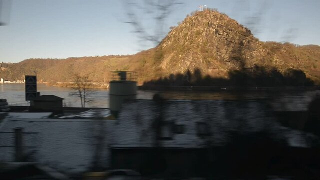 View at the Lorelei Rock in Germany, through the window of a riding train