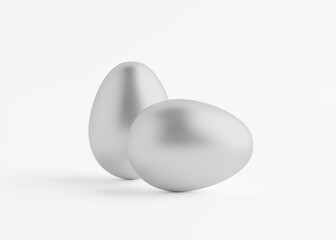 Two silver eggs close up on a white background. Easter holiday. 3D rendering and 3D illustration.