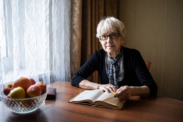 senior woman reading book