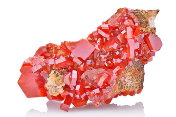 Amazing natural red raw vanadinite mineral stone closeup macro isolated on white background. Orange...