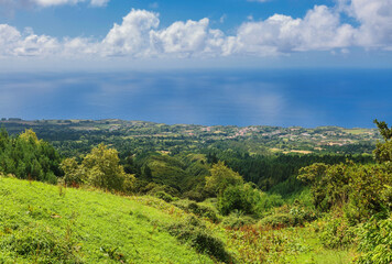 Fototapeta na wymiar View on mountains, valleys, sea coastline of Sao Miguel island