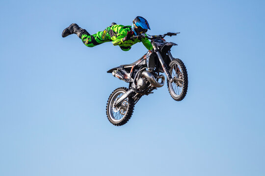 2020 Italy, Rome, KTM practice warm-up before a live-action show. Extreme sports, professional stunt biker performing a very dangerous trick in mid-air. Acrobatic riding, life or death experience.