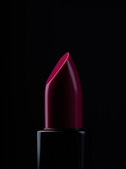 red lipstick on a black background. blank for designers