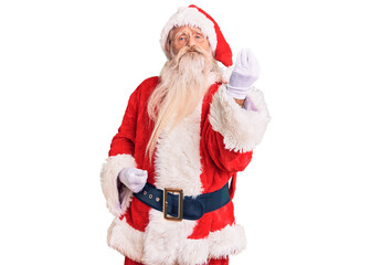 Old senior man with grey hair and long beard wearing traditional santa claus costume doing italian gesture with hand and fingers confident expression