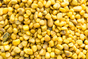 Collection Of Bright Dark Yellow Or Mustard Colored Stones Of Various Shapes And Sizes Stacked. Mostly Used For Home Garden Backyard Fountain Decor And Aquarium. Suitable For Wallpaper Or Background