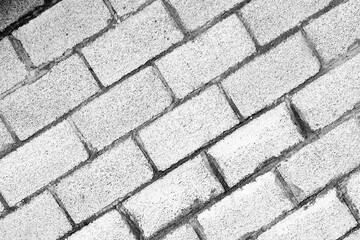 Texture of a brick wall with cracks and scratches which can be used as a background