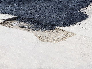 Road surface repair.  Fresh hot asphalt. 